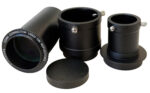 Sky-Watcher Quattro 150P included aplanatic super coma corrector and adapters with caps as an accessory set on a white background