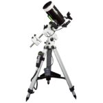 Skymax 127 EQ3 Pro SynScan Maksutov-Cassegrain telescope fully set up on EQ3 Pro equatorial mount with tripod, side view on white background.